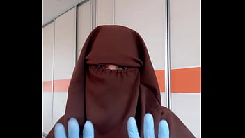 best housekeeper in apron putting on niqab best